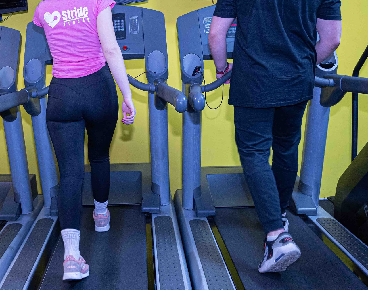 Two People Running on a Treadmill